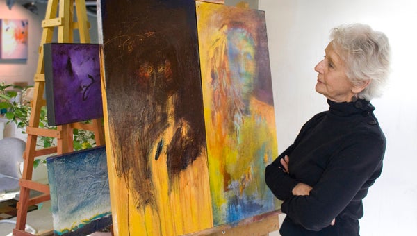 Pat Cole-Ferullo, award-winning painter, international art teacher, and TPS member with her new diptych “Bad Wolf, Good Wolf,” inspired by her current interest in Native American history, art and philosophy. 