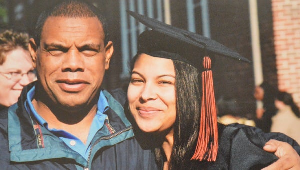 Former Polk County and Tryon basketball coach Derek Thomas is pictured with his daughter Brandie at her graduation. A memorial was held on Saturday in Polk County for Thomas, who died suddenly on Feb. 27. (Photo by Leah Justice) 