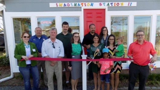 The Imagination Station II toy store held their grand opening on March 17. From left to right are Dulcie Juenger, Tim Edgens, Robert Briggs, Shawn Evans, Caitlin Cothran, Tracy McCall, Lena McCall, Rokel McCall, Brittany McCall, Marley McCall, Jaxen McCall and Mike Southern. (Photo submitted by Janet Sciacca)