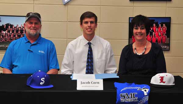 This fall, Andrew Mitchell, seated, currently a senior at Landrum High School, will be attending Eastern Nazarene College, and playing basketball for the Lions on a scholarship. On May 6, Mitchell signed his intent to attend ENC and play basketball there. In the back row, are, from left, LHS Principal Jason McCraw, men's basketball coach Lyn Smith, and Mitchell's father, Jeff Mitchell.