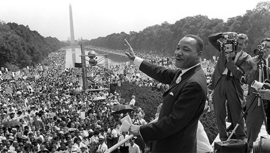 Dr. Martin Luther King, Jr. waves to supporters during his famous “I Have A Dream” speech on the steps of the Lincoln Memorial in Washington, D.C. during the March on Washington on Aug. 28, 1963. (Photo courtesy of National Geographic)