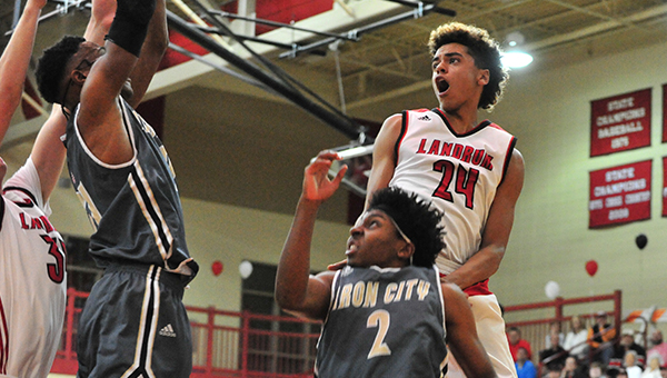 Landrum’s Manny Gonzalez (#24) appears to be climbing up the back of Blacksburg’s Jeremiah Kilgore (#2) to snag the rebound. This was one that eluded Gonzalez, who captured 11 in the Cardinals’ 74-64 win on Thursday, Feb. 9 at Landrum. This Wednesday, Feb. 15, the Cardinals host Fox Creek in round one of the state AA playoffs. Tipoff is set for 7 p.m.